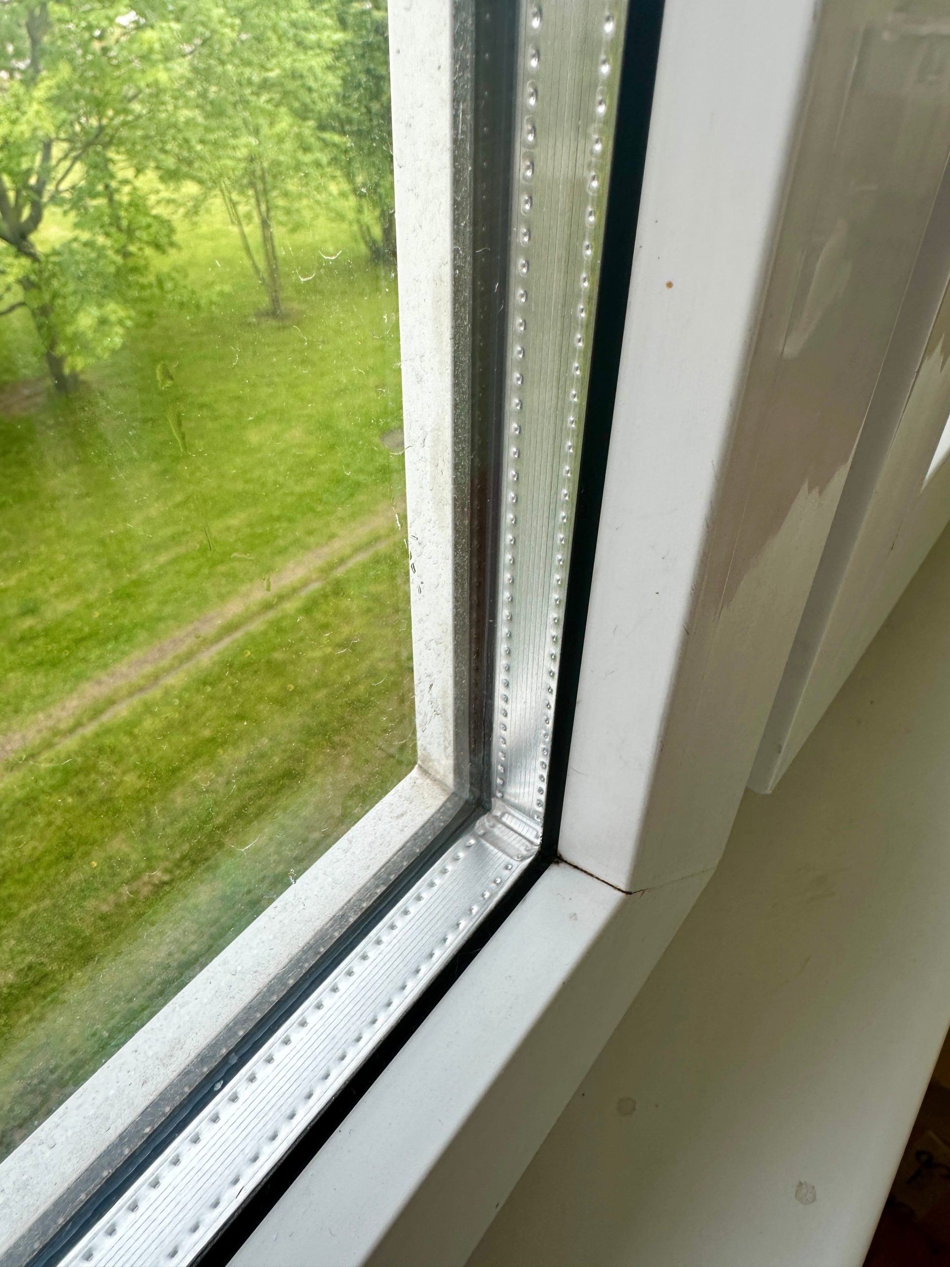 Double-glazed,Window,In,A,White,Plastic,Frame